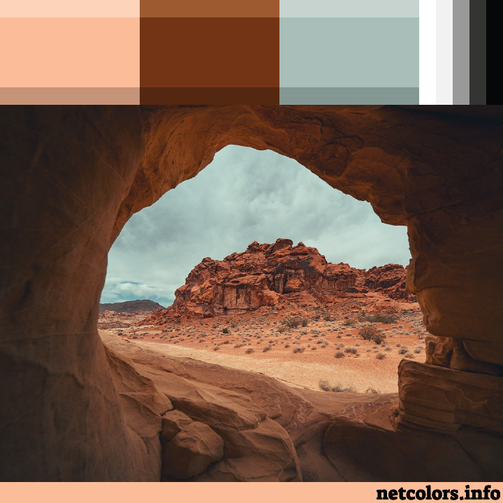 The Pantone Color of the Year 2024: Peach Fuzz color palette inspiration photo looking out from cave onto red rocks with a storm brewing in the background